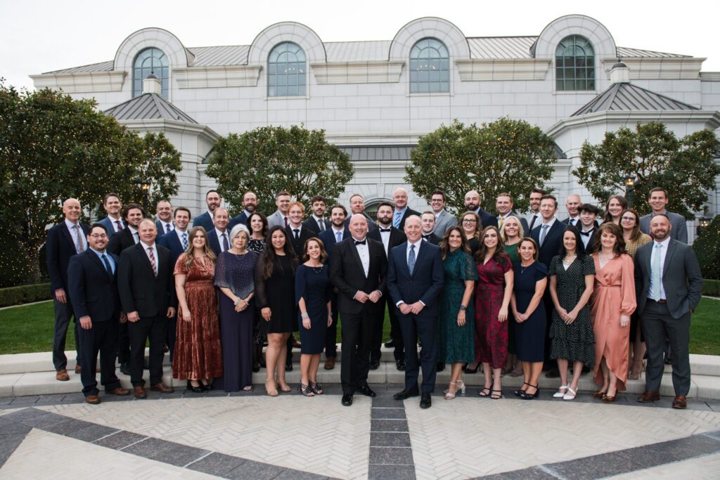 A team photo outside of a building at the 2023 Ambassador Event.